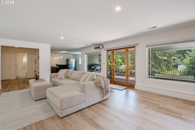 living room with light hardwood / wood-style flooring