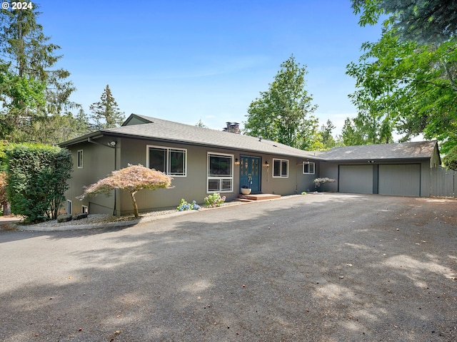 ranch-style house featuring a garage