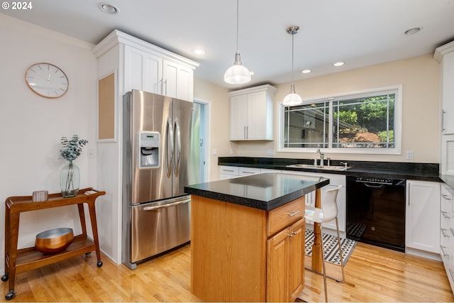 kitchen with a center island, stainless steel refrigerator with ice dispenser, white cabinetry, black dishwasher, and hanging light fixtures