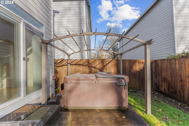 view of patio with a hot tub