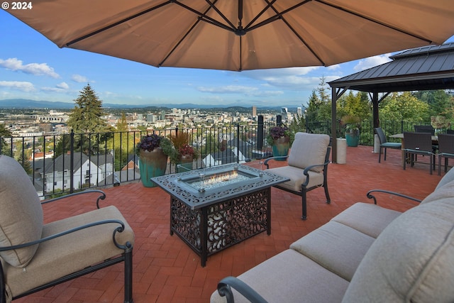 2868 NW Cumberland Rd, Portland, OR 97210 - view of patio / terrace with an outdoor living space with a fire pit, a gazebo, a mountain view, and outdoor dining space
