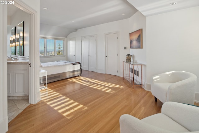 2868 NW Cumberland Rd, Portland, OR 97210 - bedroom featuring light wood-style flooring, recessed lighting, and vaulted ceiling