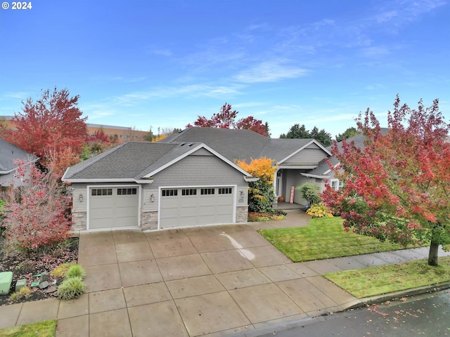 view of front of house with a front lawn and a garage