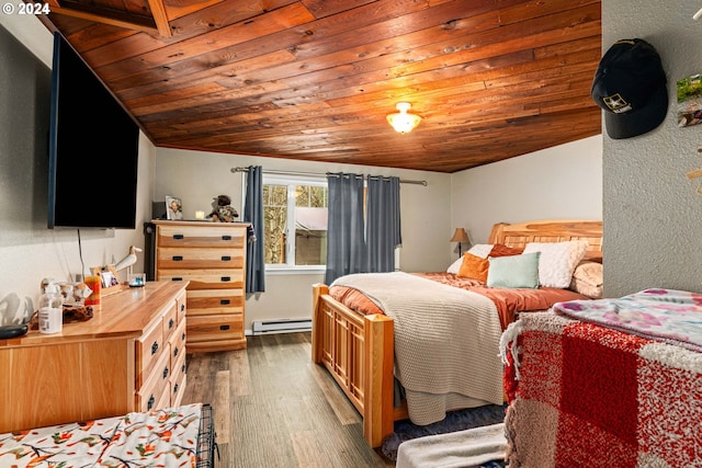 bedroom with vaulted ceiling, wood ceiling, a baseboard heating unit, and wood finished floors