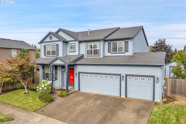 view of front facade featuring a garage and a front lawn