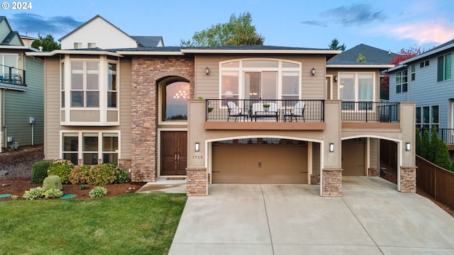 view of front facade with a garage and a front yard