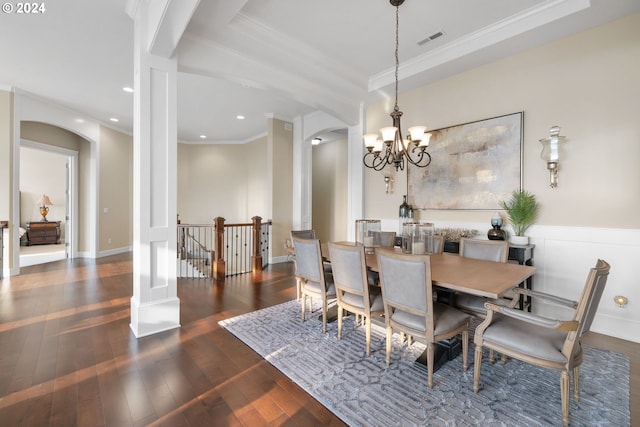 dining room featuring ornamental molding, dark hardwood / wood-style floors, and a chandelier