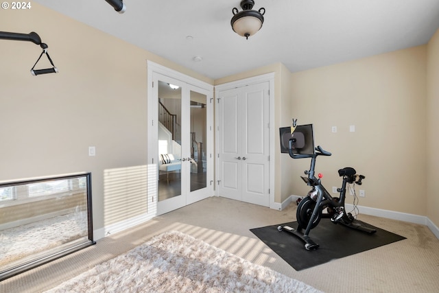 workout room with light colored carpet