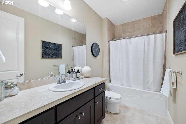 full bathroom with vanity, toilet, tile patterned flooring, and shower / bath combo