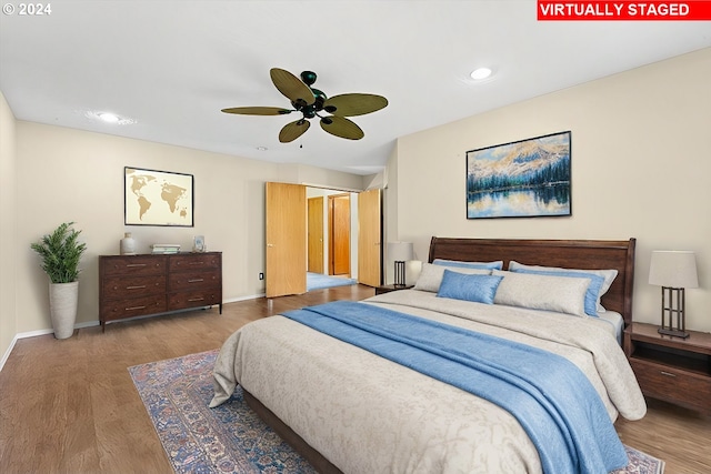 bedroom featuring ceiling fan and hardwood / wood-style flooring