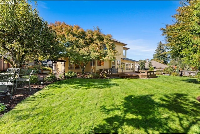 view of yard with a wooden deck