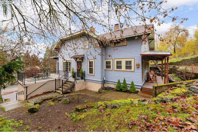 view of front of house featuring a garage and a balcony