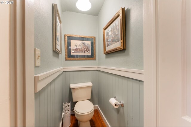 bathroom featuring toilet and wood-type flooring