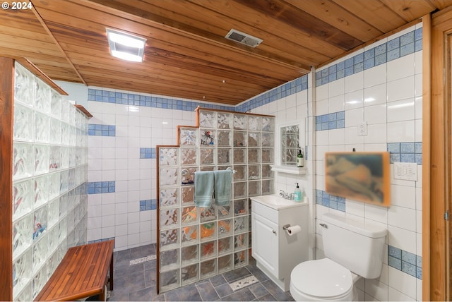 bathroom with vanity, wooden ceiling, tile walls, and walk in shower