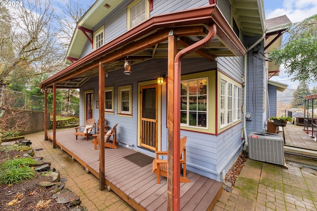 wooden terrace featuring central AC unit