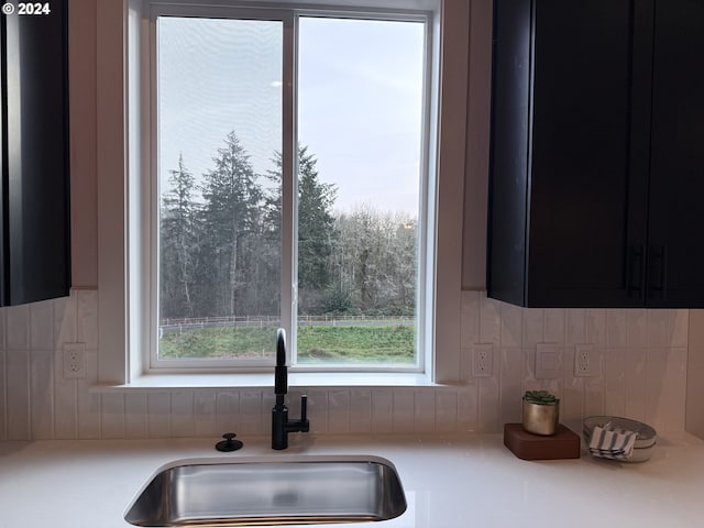 kitchen with sink and tasteful backsplash