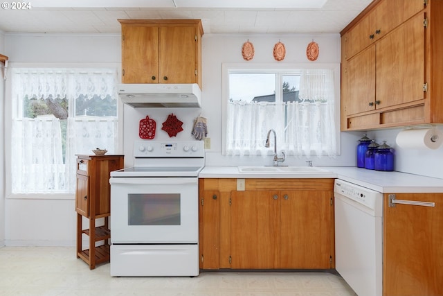 kitchen featuring white appliances and sink