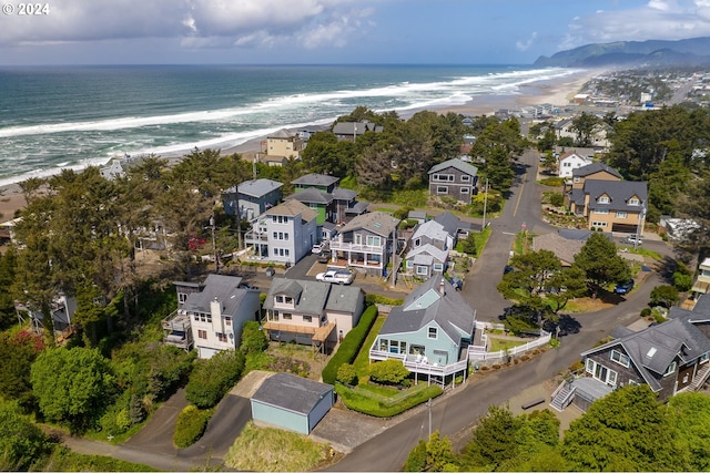 bird's eye view with a beach view and a water view