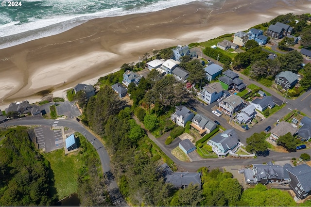 bird's eye view with a beach view and a water view