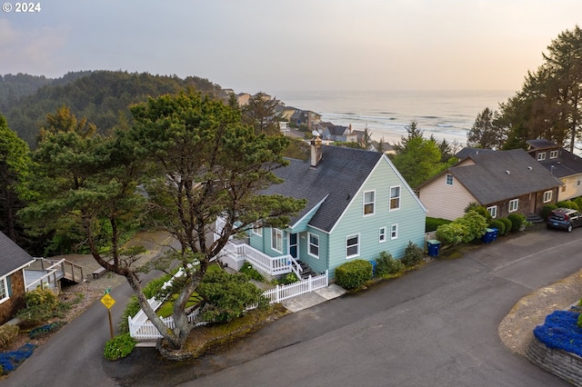 aerial view at dusk with a water view