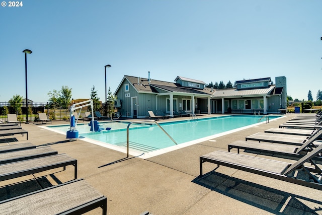 view of swimming pool with a patio area