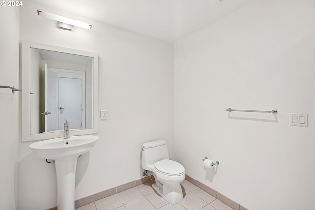 bathroom with tile patterned floors and toilet