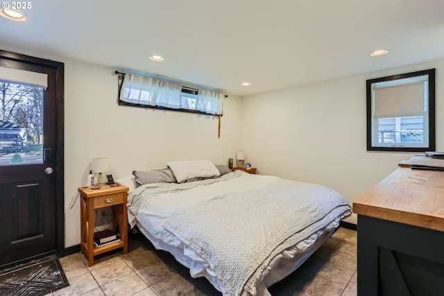 tiled bedroom with multiple windows