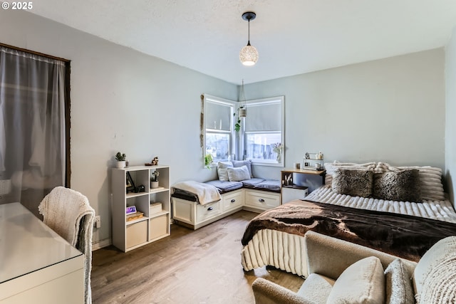 bedroom with light wood-type flooring