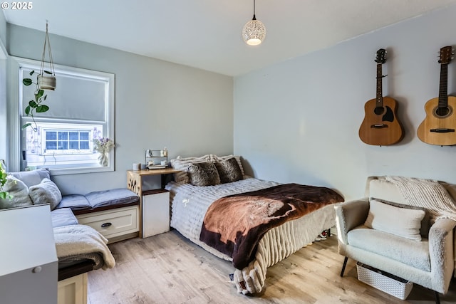 bedroom with light hardwood / wood-style flooring