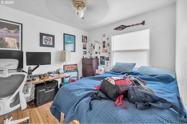 bedroom featuring hardwood / wood-style floors and ceiling fan