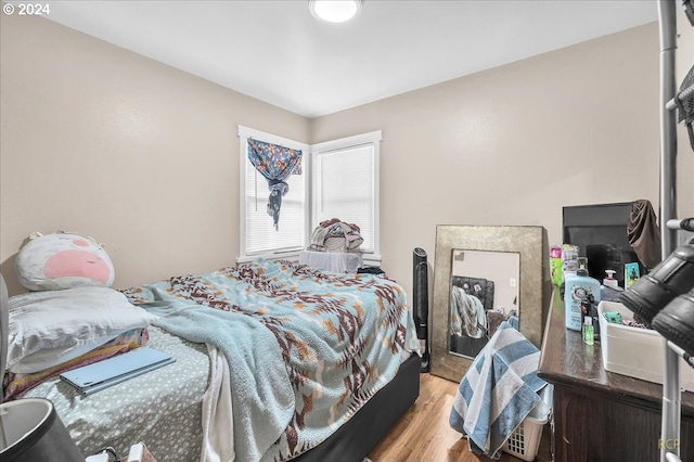 bedroom with light hardwood / wood-style floors