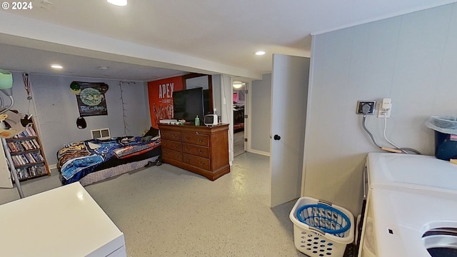 bedroom featuring separate washer and dryer