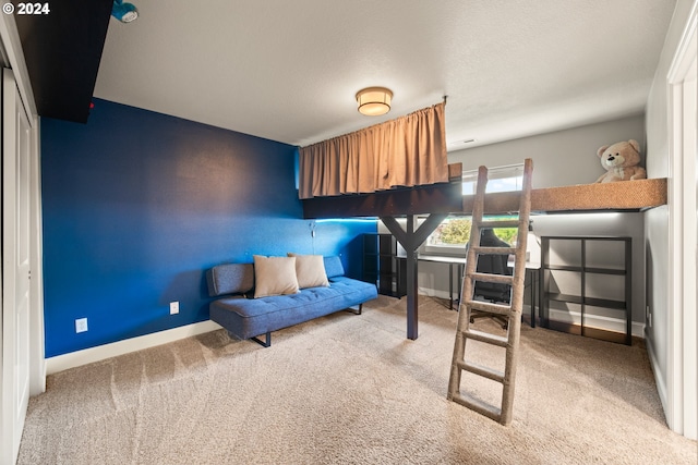 carpeted bedroom with a closet