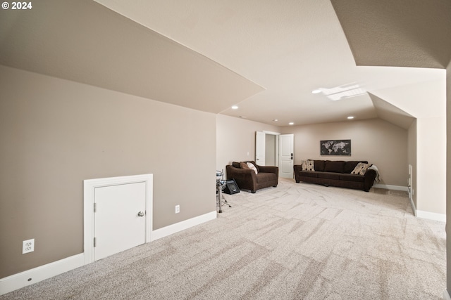 additional living space with lofted ceiling and light colored carpet