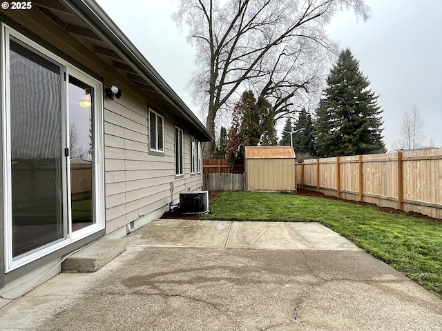 view of patio with central air condition unit and a shed