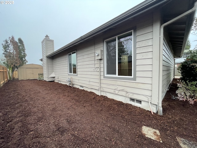 view of home's exterior featuring a shed