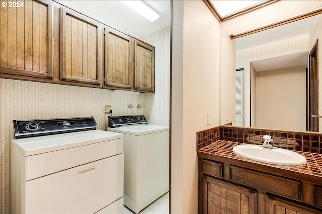 laundry area featuring separate washer and dryer and sink