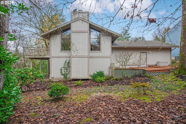 view of side of property featuring a deck