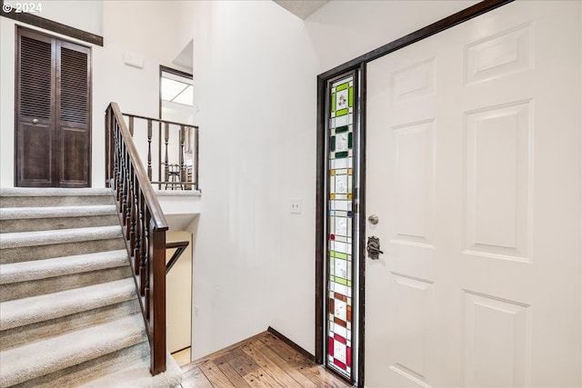 entryway with plenty of natural light and light hardwood / wood-style flooring