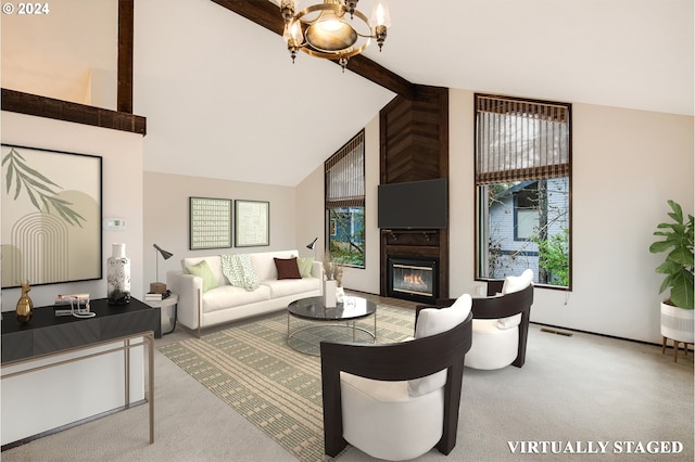 living room featuring carpet flooring, high vaulted ceiling, a healthy amount of sunlight, and a notable chandelier