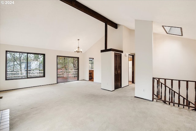 spare room featuring beamed ceiling, light colored carpet, high vaulted ceiling, and a chandelier