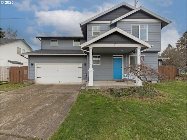 view of front of home with fence, a front lawn, an attached garage, driveway, and covered porch