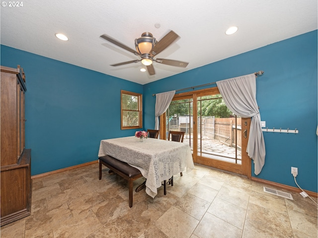 tiled bedroom featuring ceiling fan and access to exterior