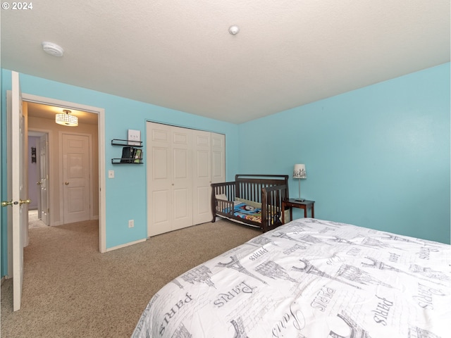 bedroom with a closet and carpet flooring