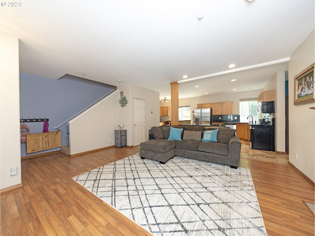 living room with light hardwood / wood-style floors