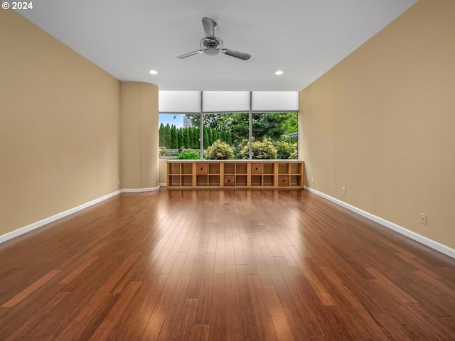 unfurnished room featuring hardwood / wood-style flooring and ceiling fan