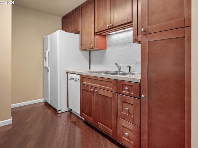 kitchen featuring dark hardwood / wood-style flooring, sink, white dishwasher, and decorative backsplash