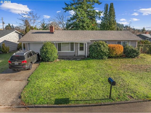 single story home featuring a front yard and a garage