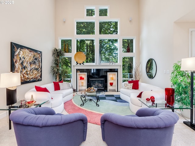4374 M Loop, Washougal, WA 98671 - living area with a high ceiling, a tile fireplace, healthy amount of natural light, and carpet flooring