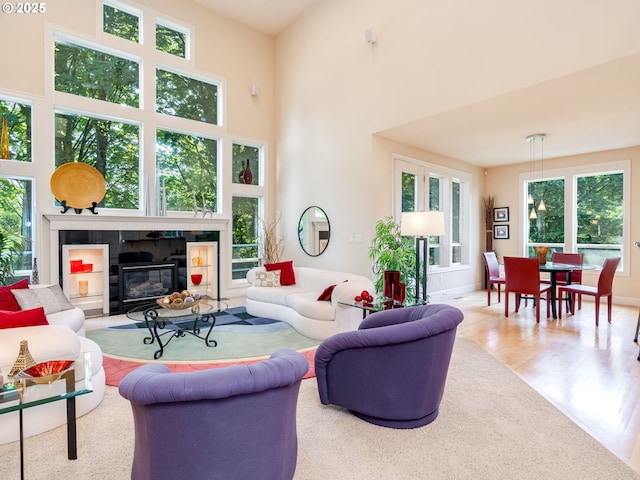 4374 M Loop, Washougal, WA 98671 - living room featuring a tile fireplace, wood finished floors, and a high ceiling